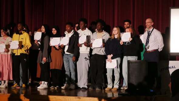 Group of students that were inducted new members of the National Honor Society and principal.