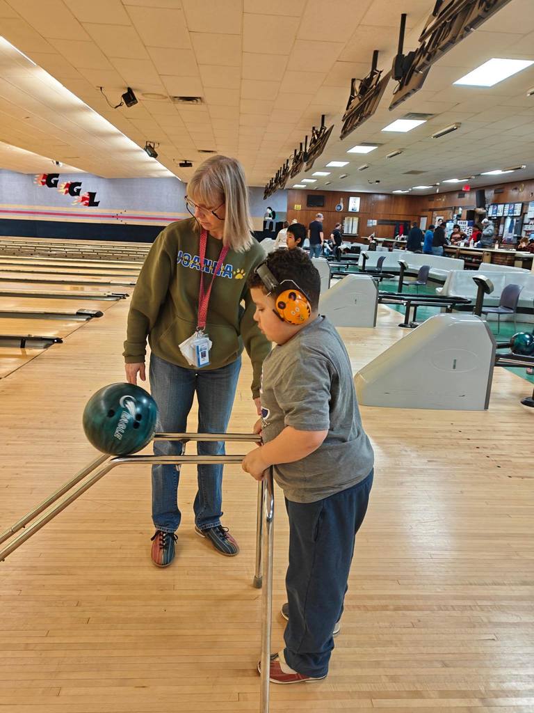 A student bowling. 
