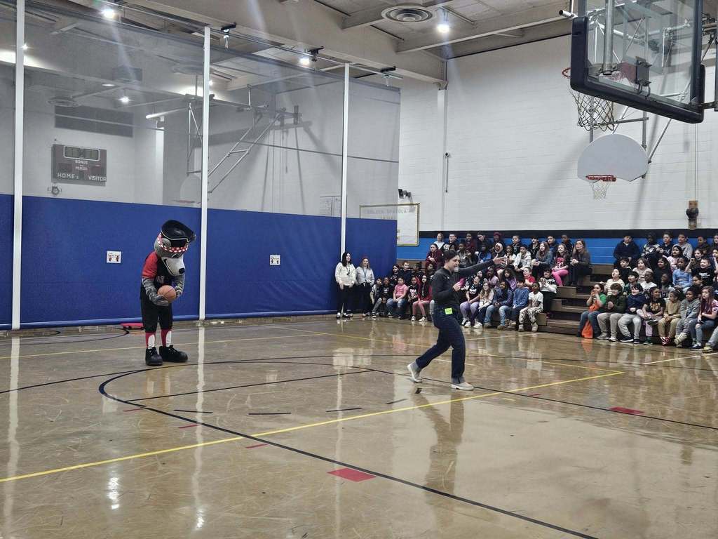 Erie SeaWolves Mascot preparing to throw a basketball. 