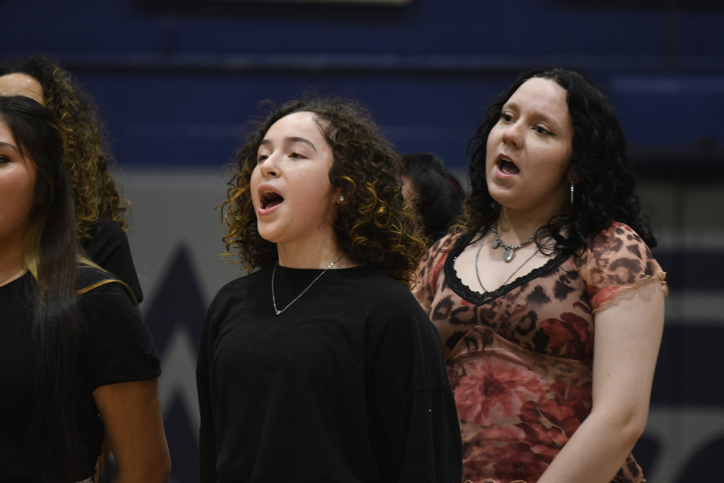 2 girls from the choir singing