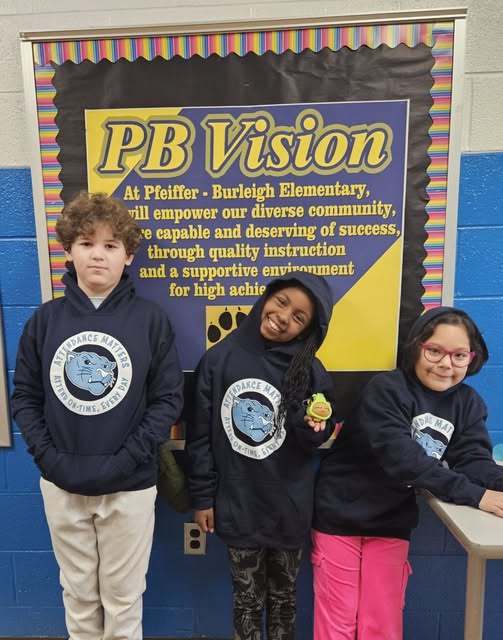 Students wearing matching Attendance Matters hoodies. 