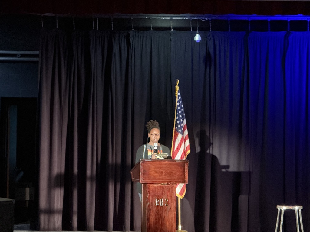 Announcing the guest speaker. 