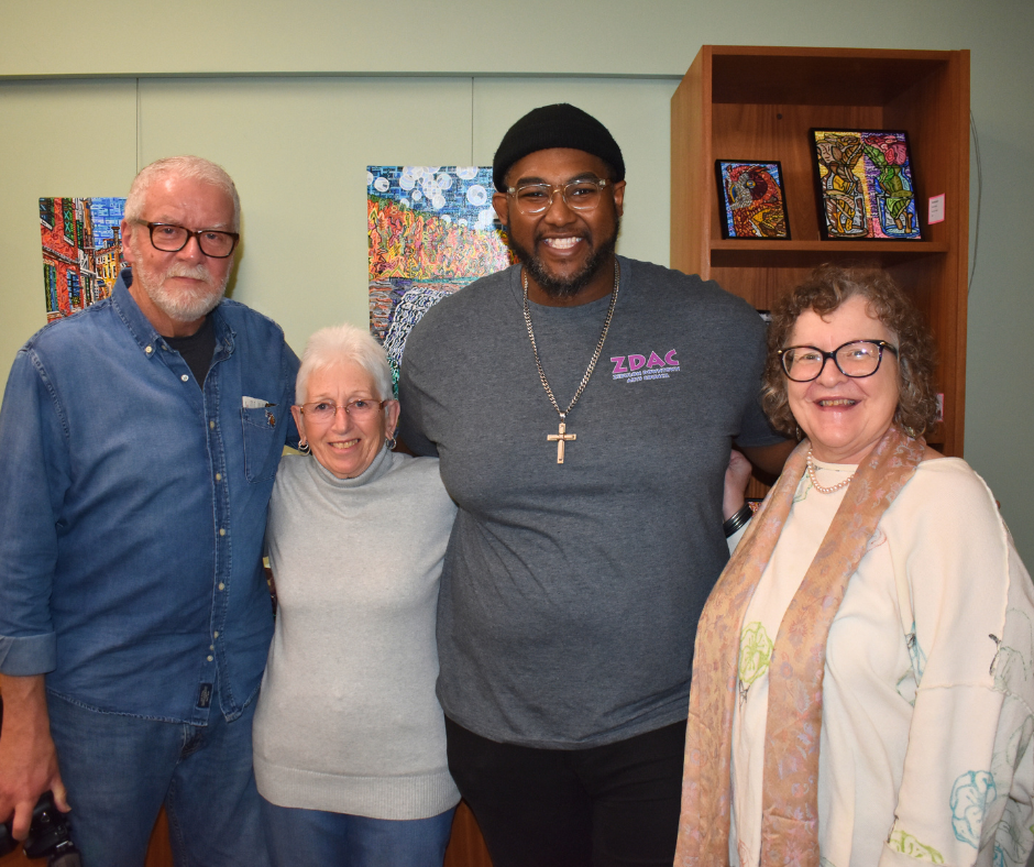 4 people standing together 