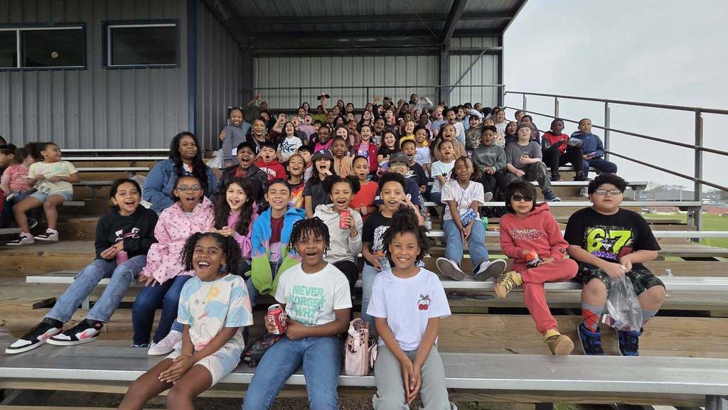 elementary students at baseball game