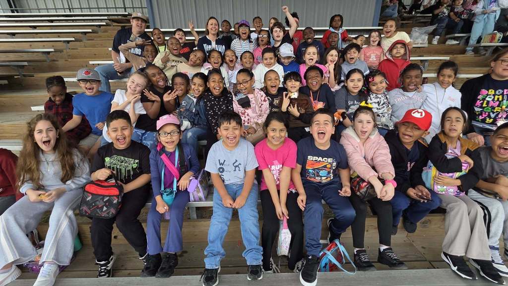 elementary students at baseball game