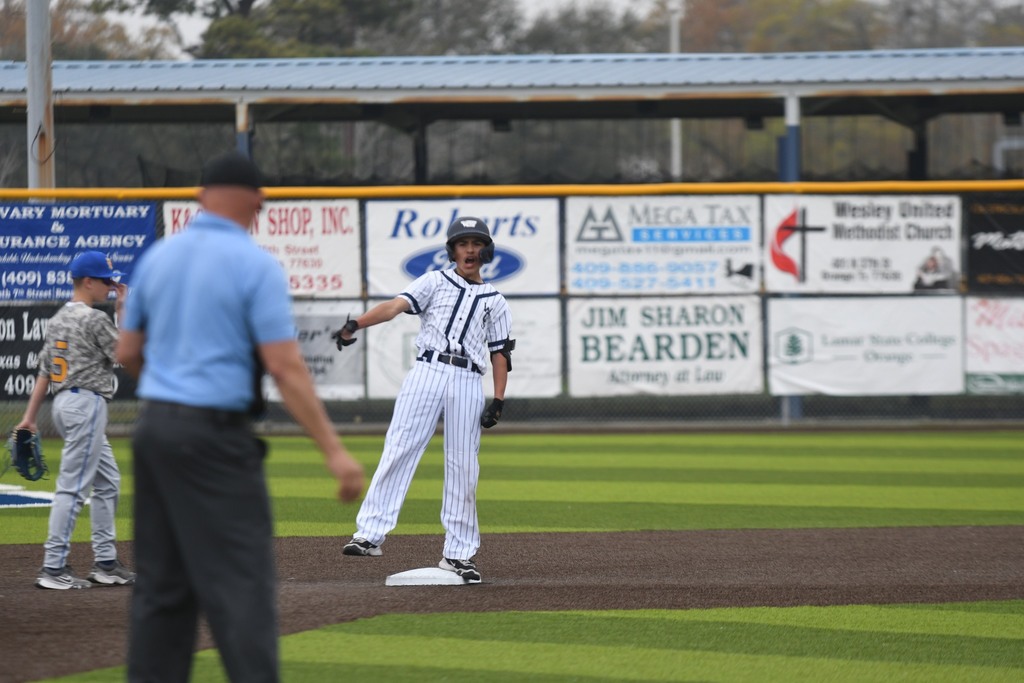 player at third base celebrating
