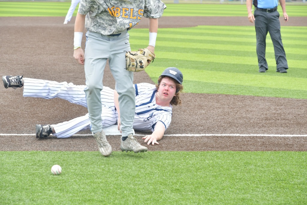 player sliding into third base