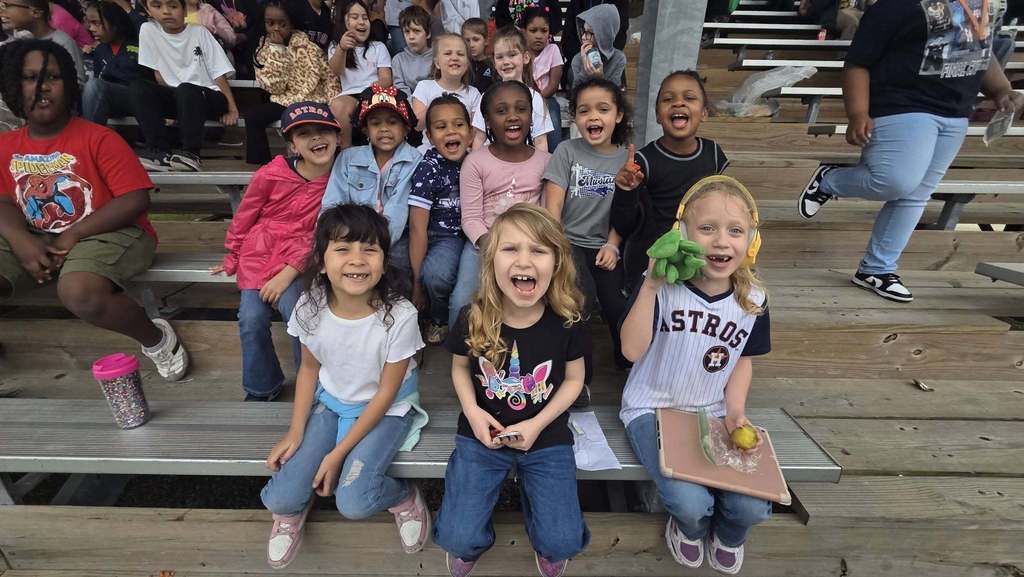 elementary students at baseball game