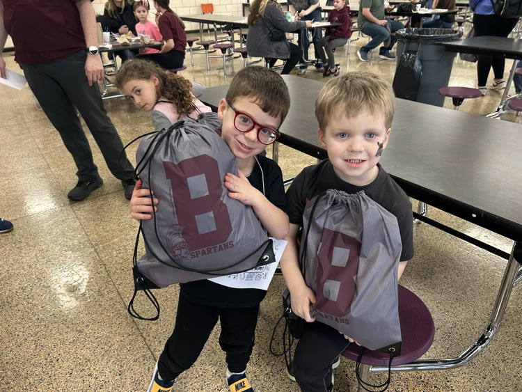 two boys holding their Spartan Kindergarten swag bags