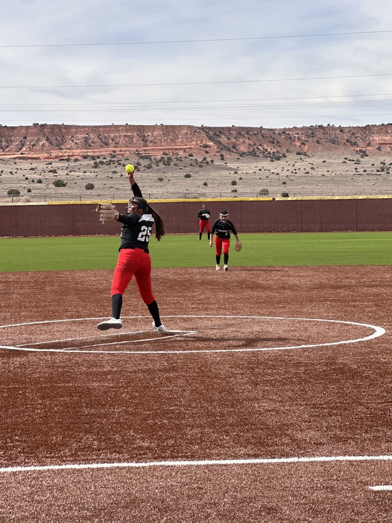 Pitcher on the mound winding up 