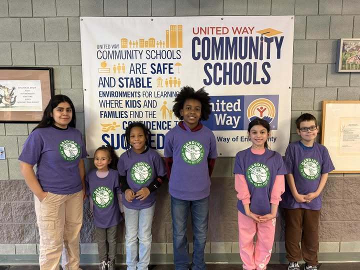 Students wearing matching purple Harding shirts. 