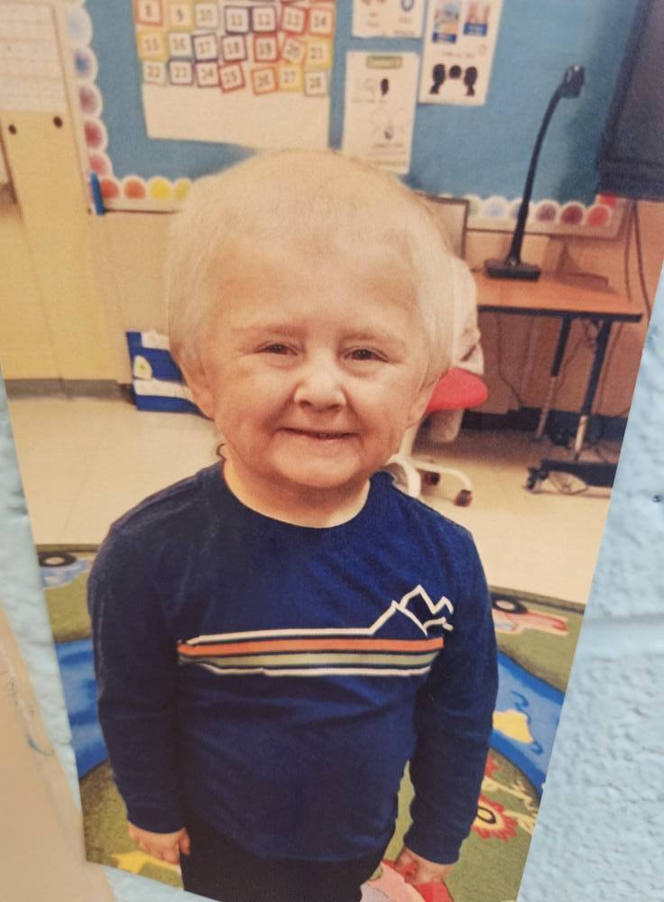 A photo of a student with a filter on to make them look like an elderly person.. 