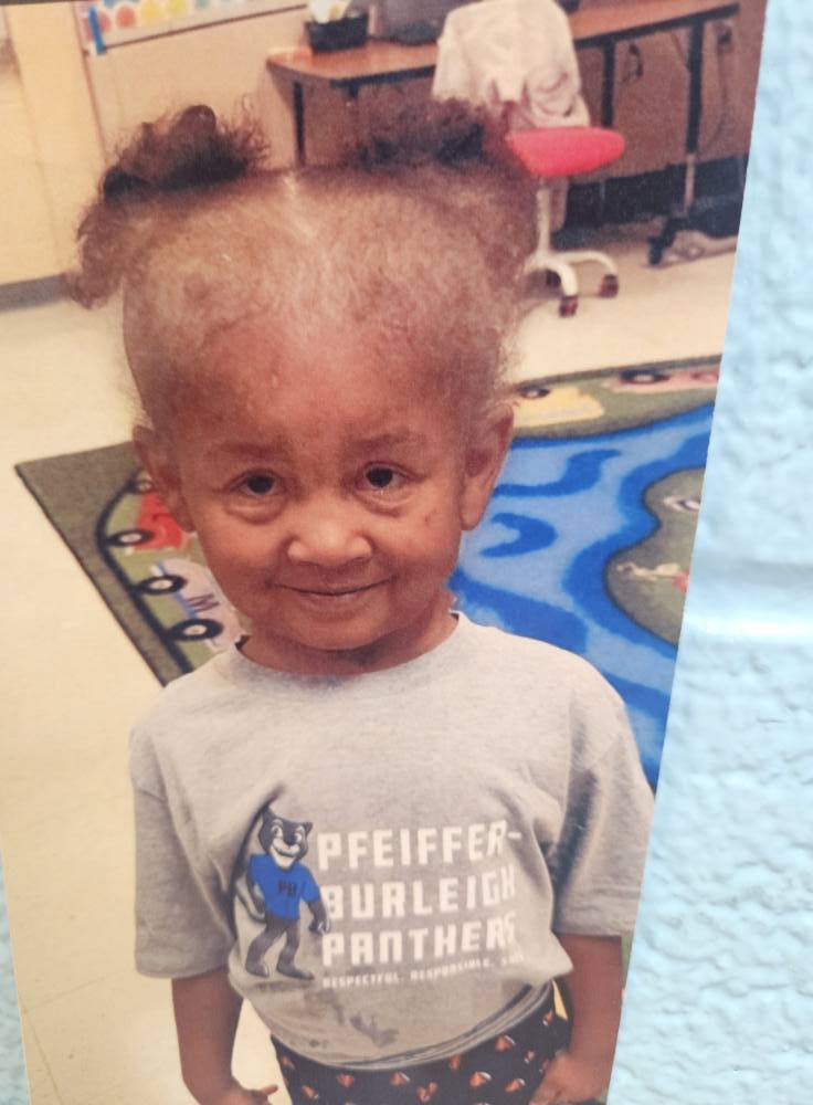 A photo of a student with a filter on to make them look like an elderly person.. 