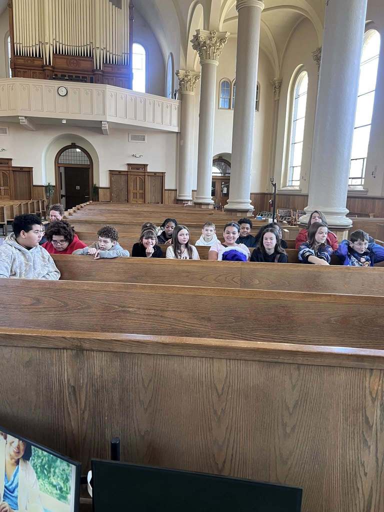 People sitting in a church. 