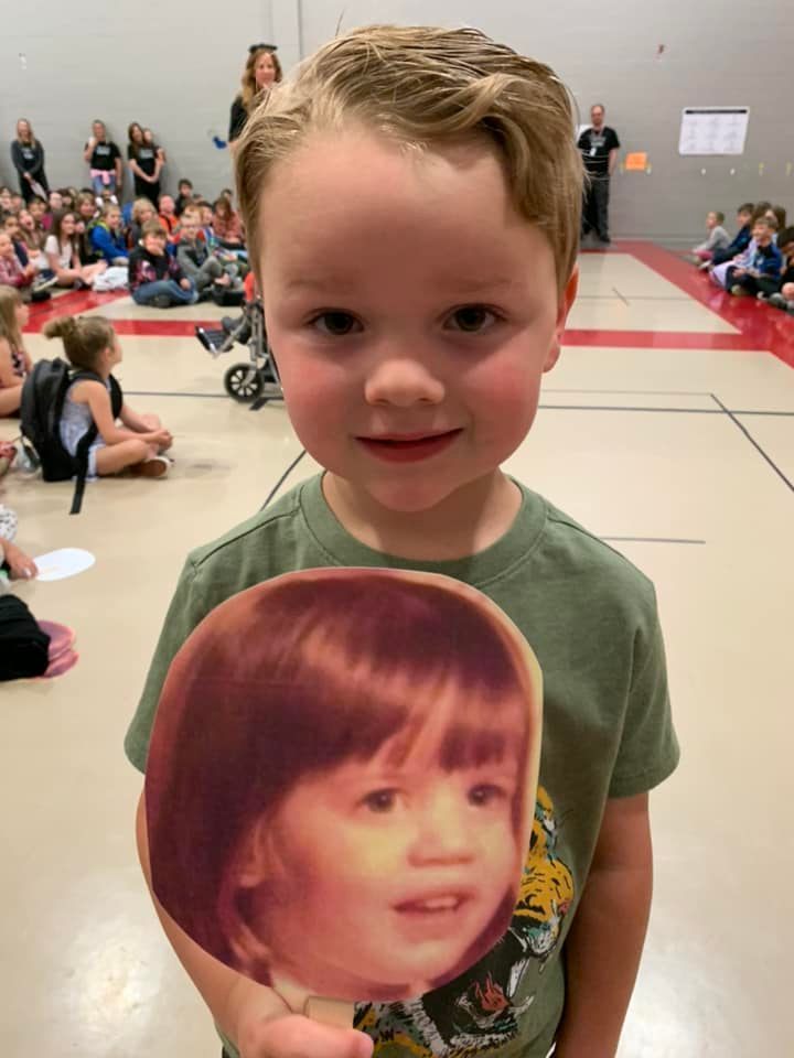 student with faces of Mrs. Shuck