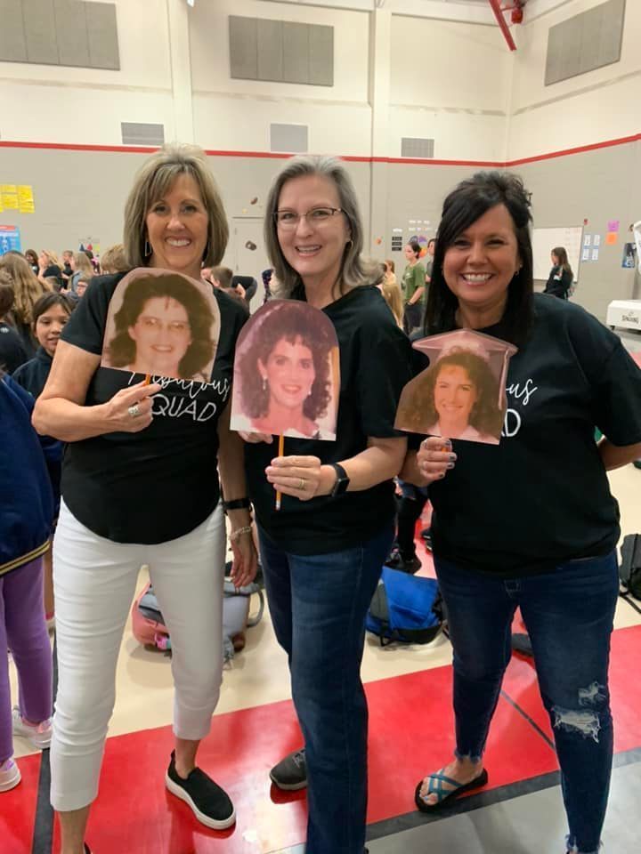 teacher with faces of Mrs. Shuck