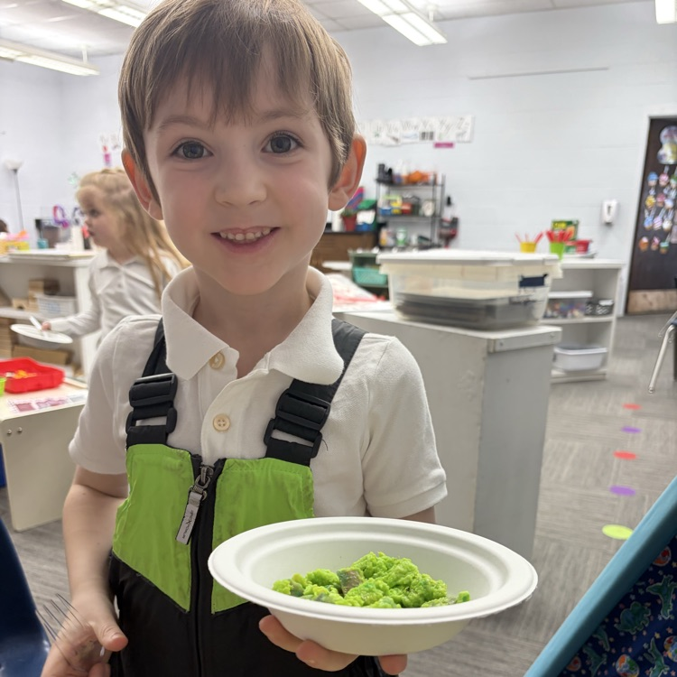 Students showing green eggs and ham