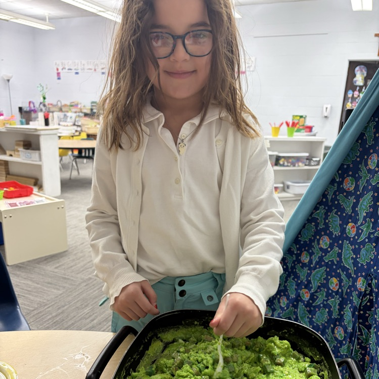 Student mixing green eggs