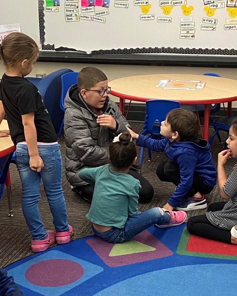 Students sitting together on floor