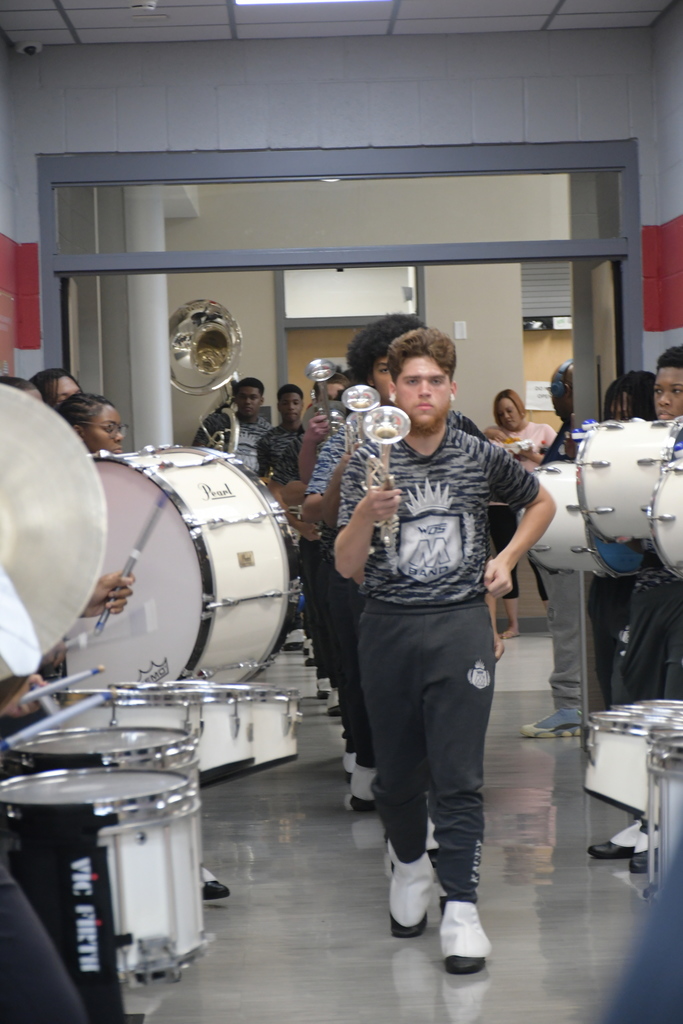 M3 Band horn section walking out to the court