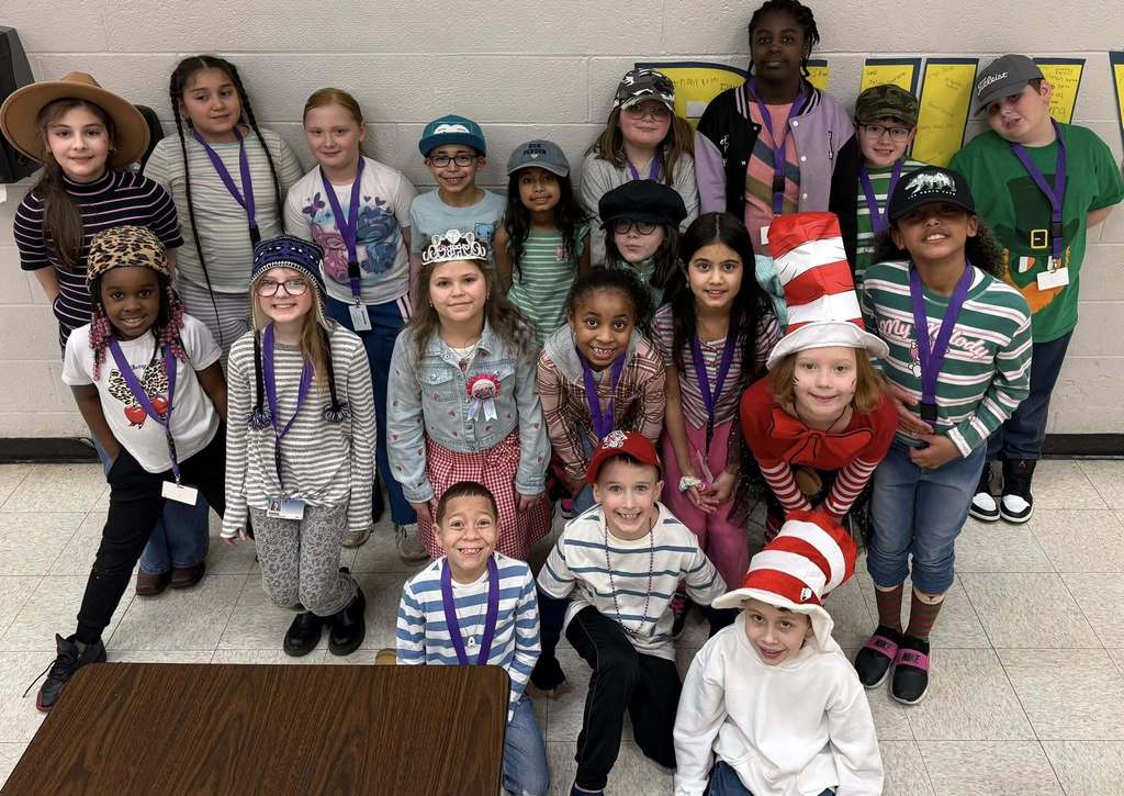 Students wearing fun hats and striped shirts. 
