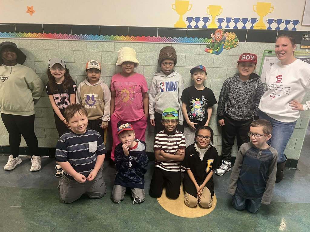 students wearing fun hats in the hall. 