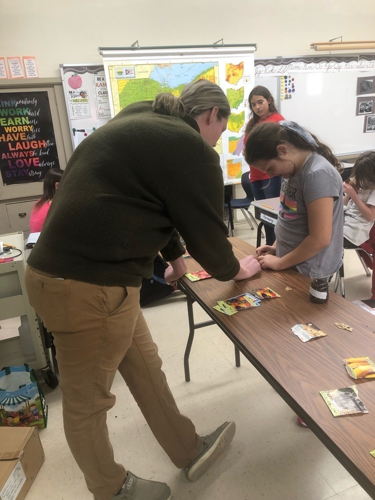 students planting seeds