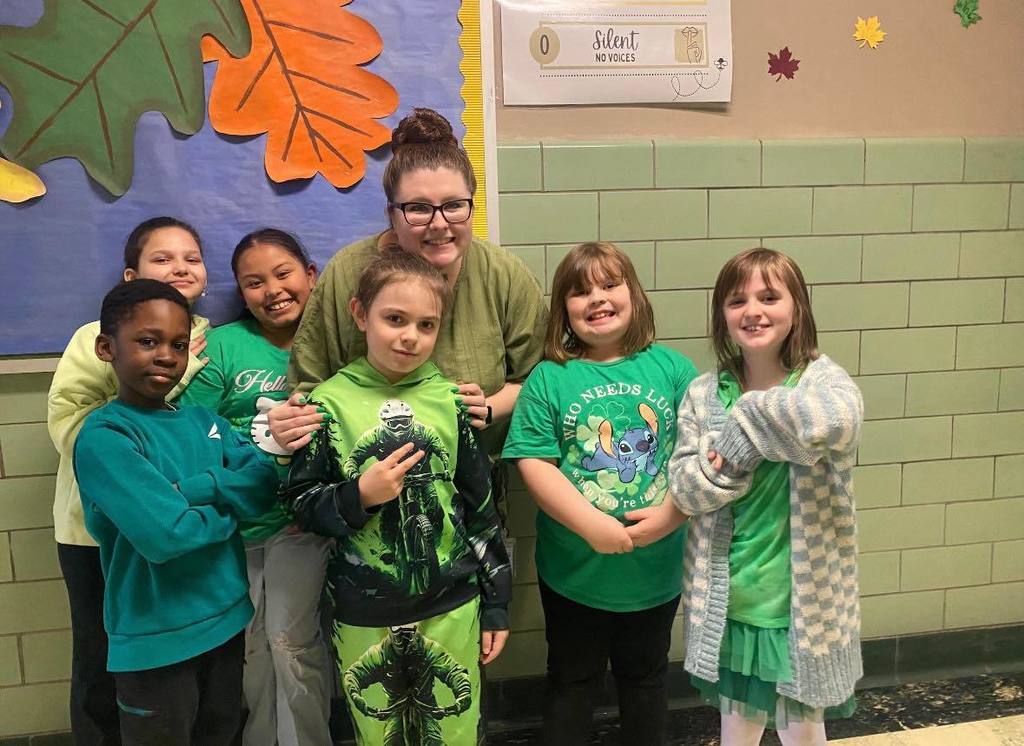 Teacher and students wearing green.