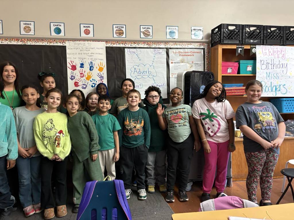 Teacher and students wearing green.