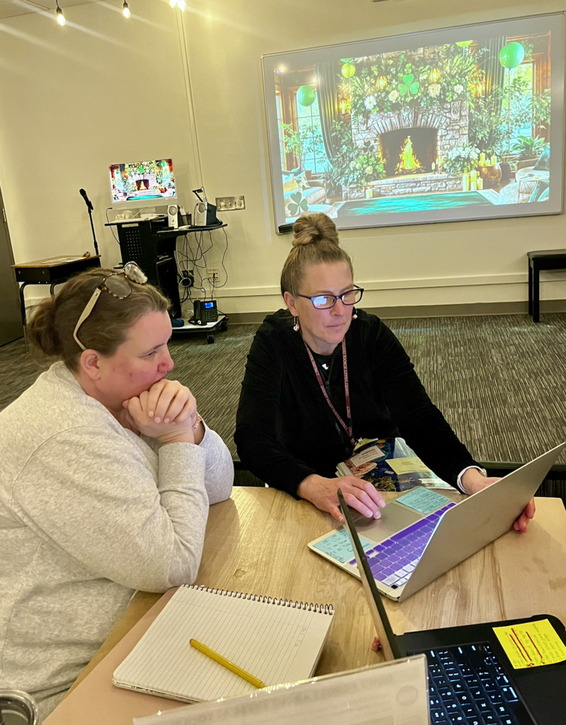 Two teachers working together to learn about AI.