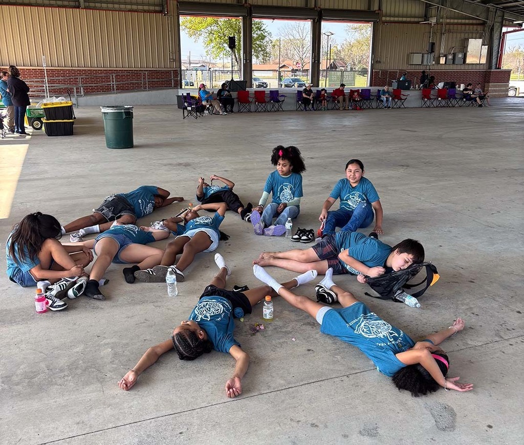 Elementary students laying around after some hard work