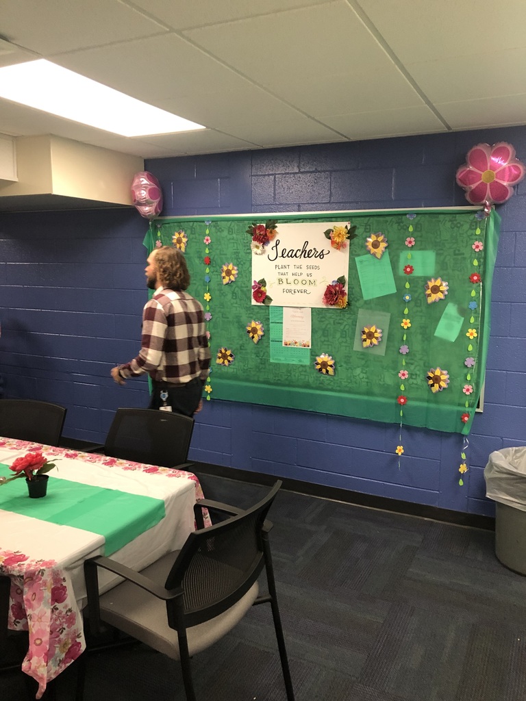 teachers in staff lounge with food and decorations