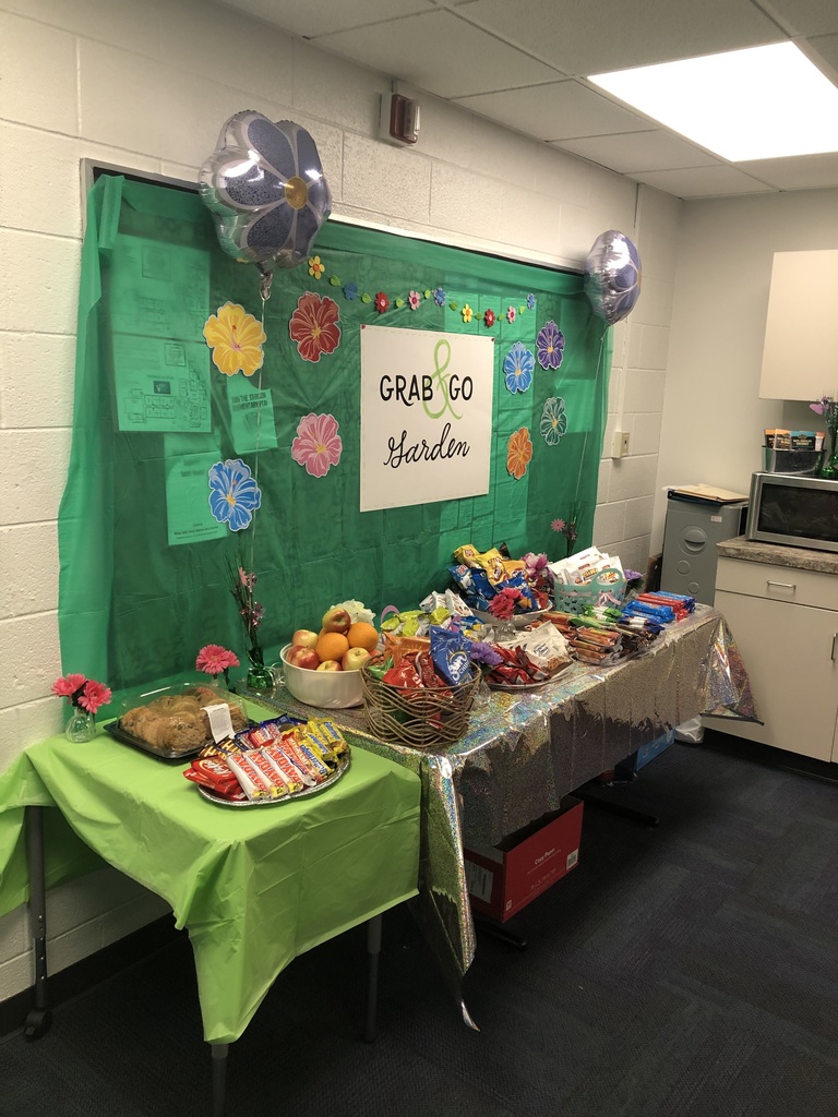 teachers in staff lounge with food and decorations