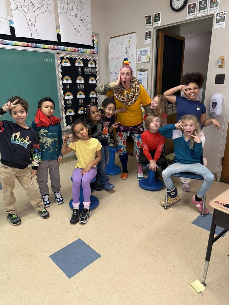 Students and teacher wearing their clothes backwords, inside out, and mismatched for Read across America week.