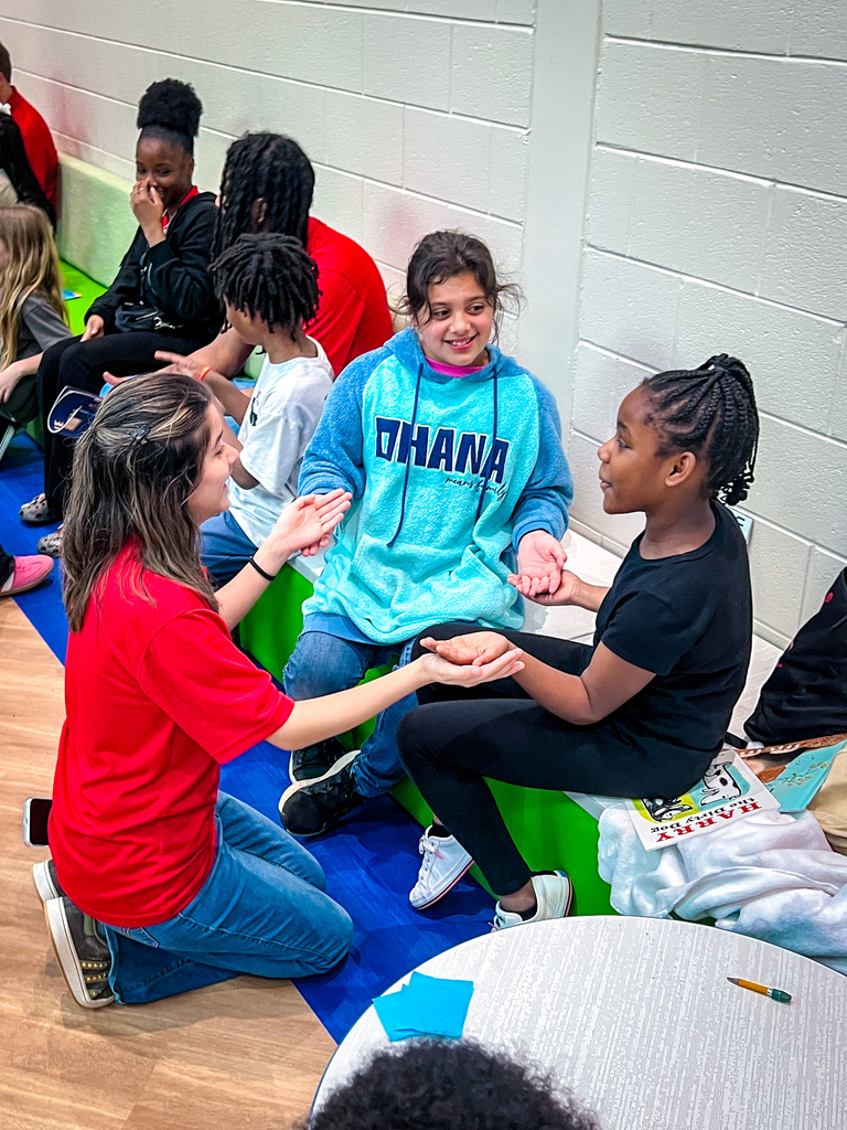 PCHS Service Leadership reading with PCES Trailblazers