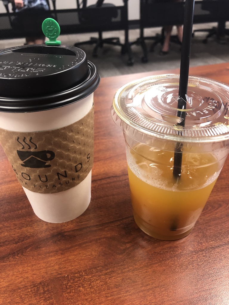 A cup of coffee and a glass of ice tea.