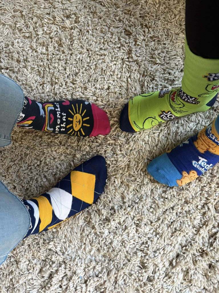 Kids wearing crazy socks. 