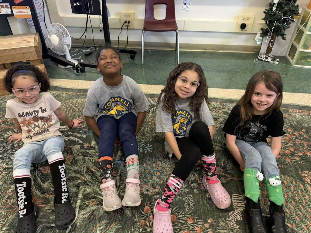 Kids wearing crazy socks.