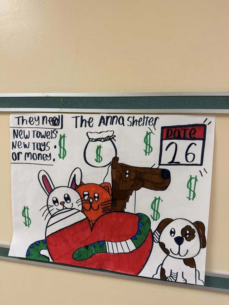 A poster students made that show animals on it and state the things they are collecting for the Anna Shelter so people can donate. 