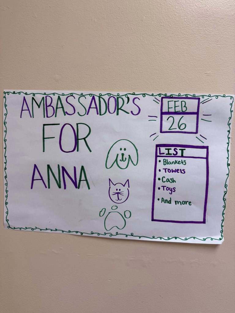 A poster students made that show animals on it and state the things they are collecting for the Anna Shelter so people can donate. 