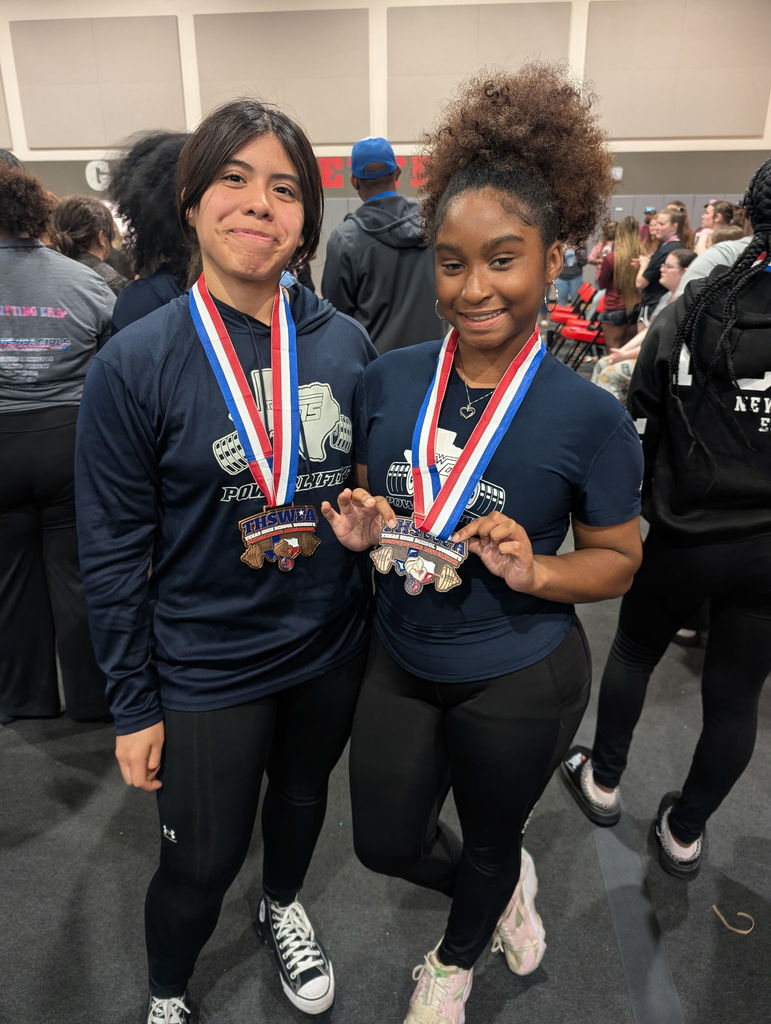 2 WOS powerlifters posing with medal