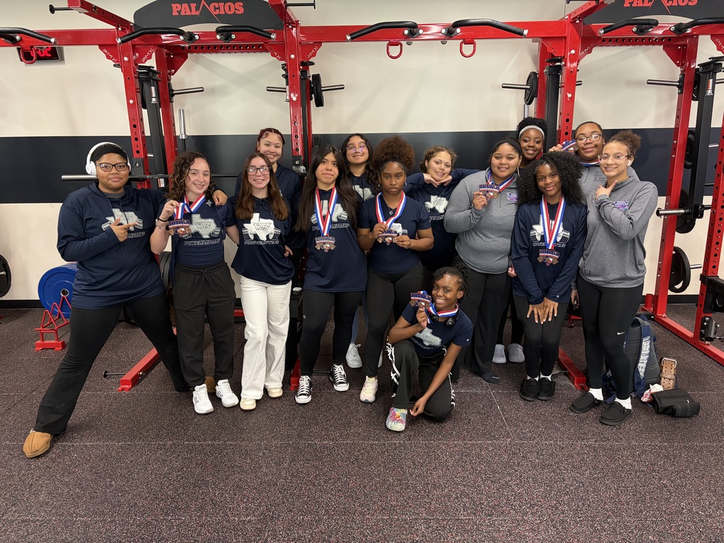 WOS girls powerlifting posing in 