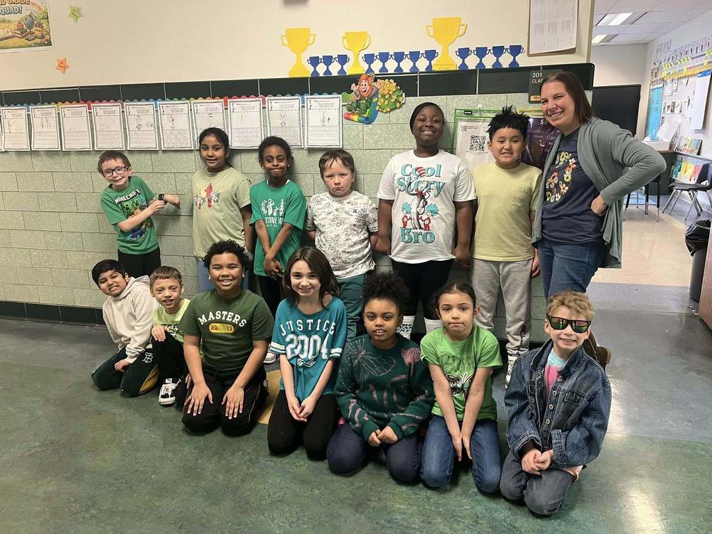 Students and teacher dressed in green. 