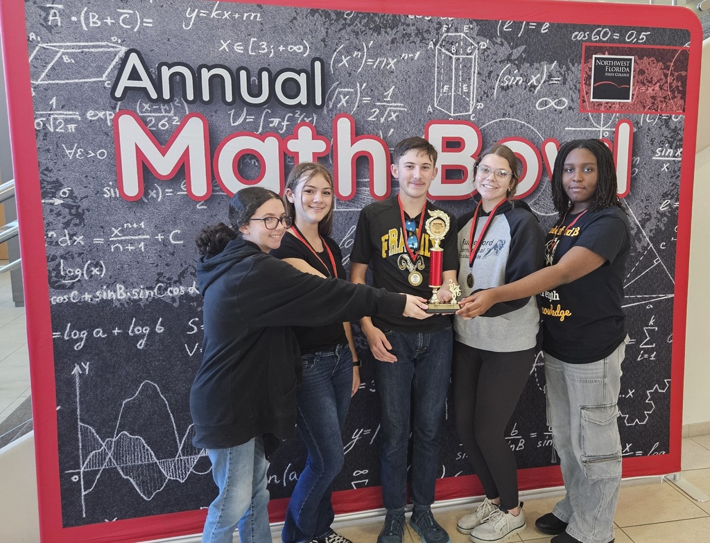 Rutherford Students hold their 3rd place Trophy from the Annual Math Bowl