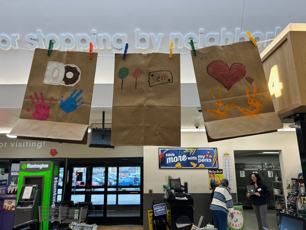 Brown bags with handprints, hearts and lollipops