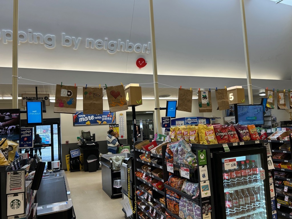 brown grocery bags decorated by students hang in the aisles at Boardman Giant Eagle
