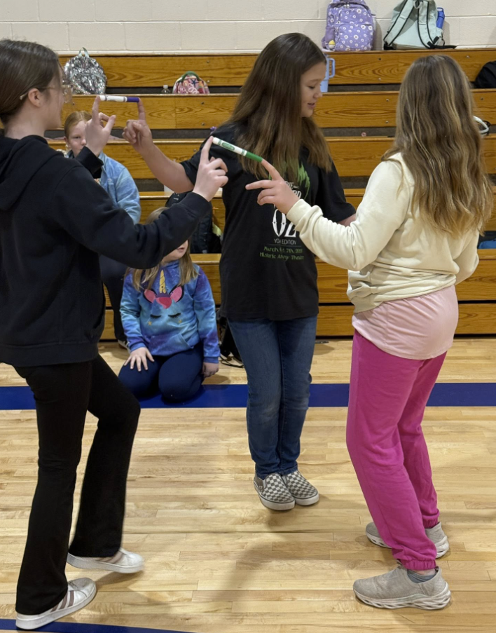 All Together Now! 💙💛💚❤️ Today our Houses kicked off with an assembly full of teamwork, laughter, and just a little bit of strategy! Students competed in a race across the gym, but there was a catch! Each team had to get every member from one end to the other while staying connected using only one finger and a marker. No breaking the chain! It was the perfect way to launch our March Character Strong focus: Collaboration. Students quickly learned that success wasn’t about speed alone — it was about communication, patience, encouragement, and working together toward a common goal. These schoolwide assemblies are powerful for our students and our staff. While students build relationships and school spirit, our teachers gain valuable time to collaborate and dive into data to better support every learner. We are stronger when we work together. 💪 #AllTogetherNow #CharacterStrong #Collaboration #HousePride