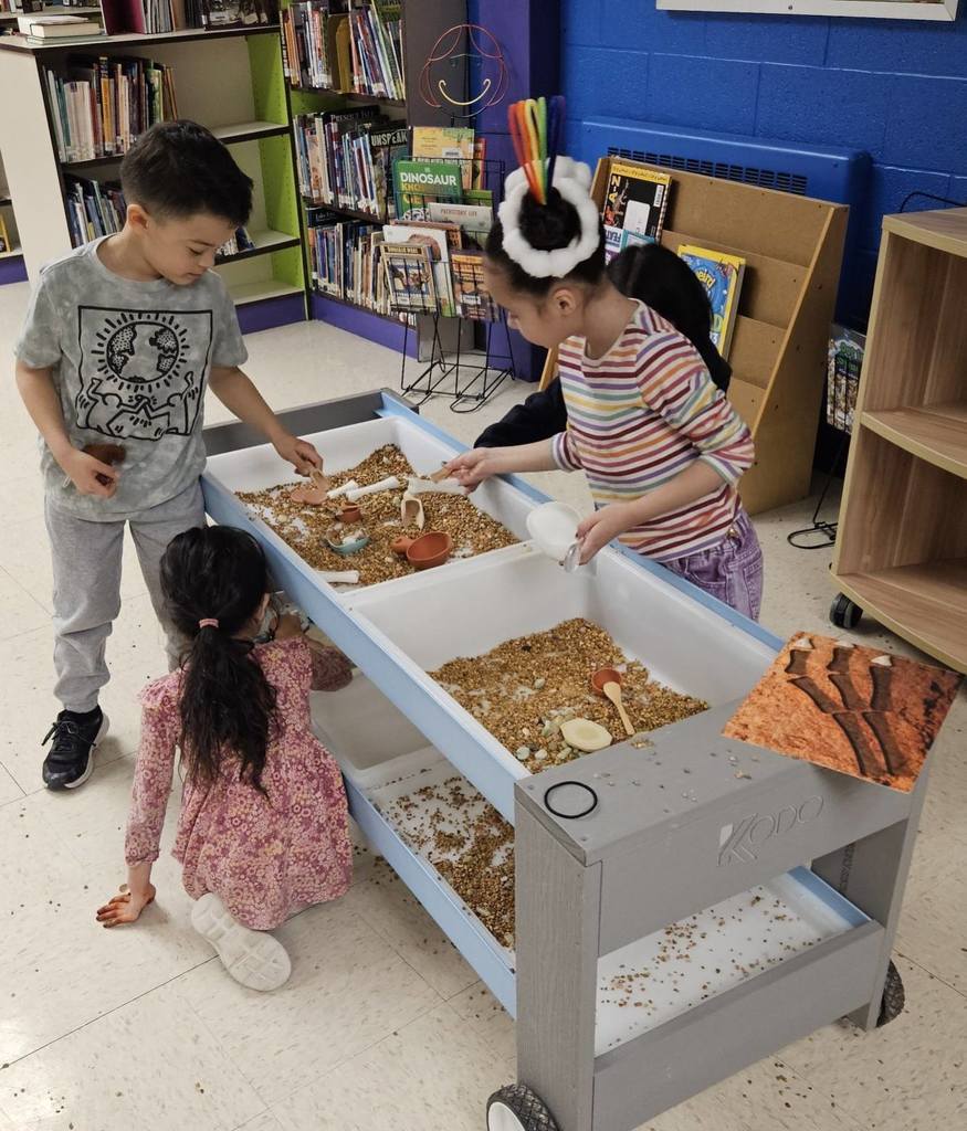 Kids playing with dirt. 