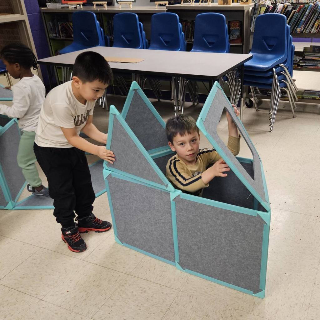 Kids playing by building a ship.