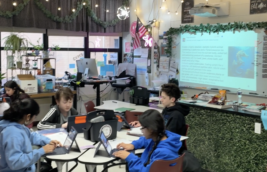 Students working on Magic School Student: inputting traits and characteristics of 2 organisms to make a hybrid organism.